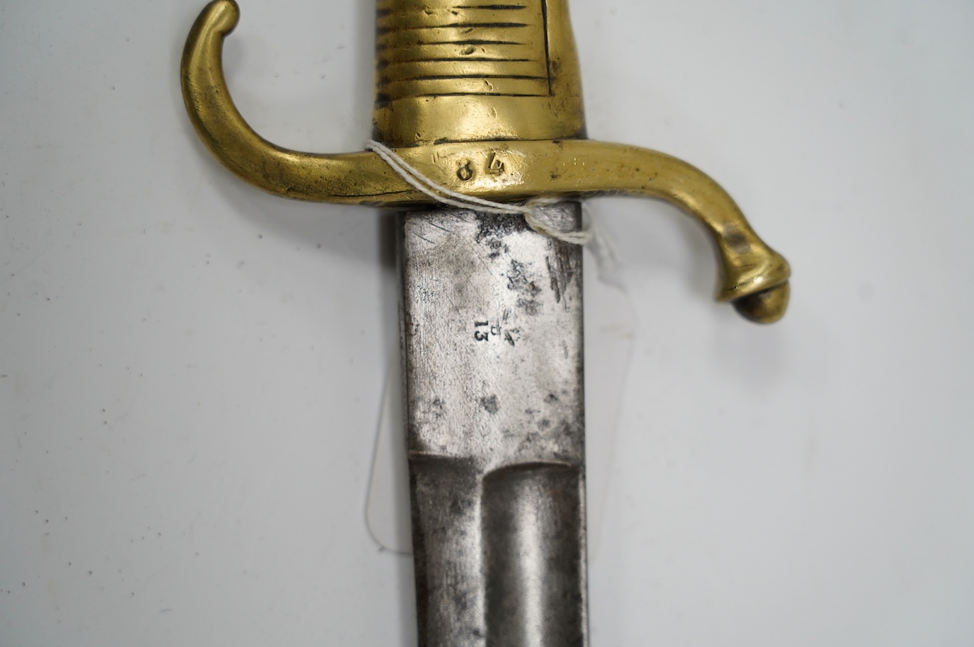 A composite short sword, British military blade by Reeves with Continental brass hilt, blade 66.5cm. Condition - fair